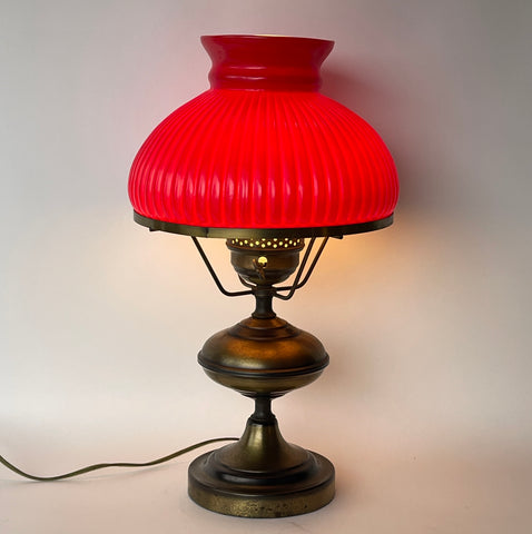 Vintage Early American Aged Brass Oil Lamp Style Table Lamp with Ruby Red Ribbed Student Shade