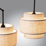 Deena Matte Black Metal 3-Light Arc Floor Lamp with Retro Tiered White Linen Drum Shade