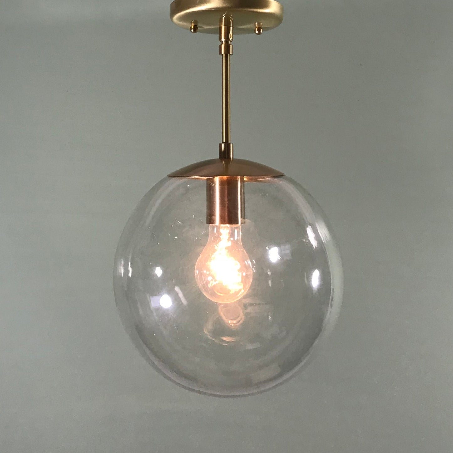 Mid Century Modern 10" Clear Glass Globe Pendant in Satin Brass