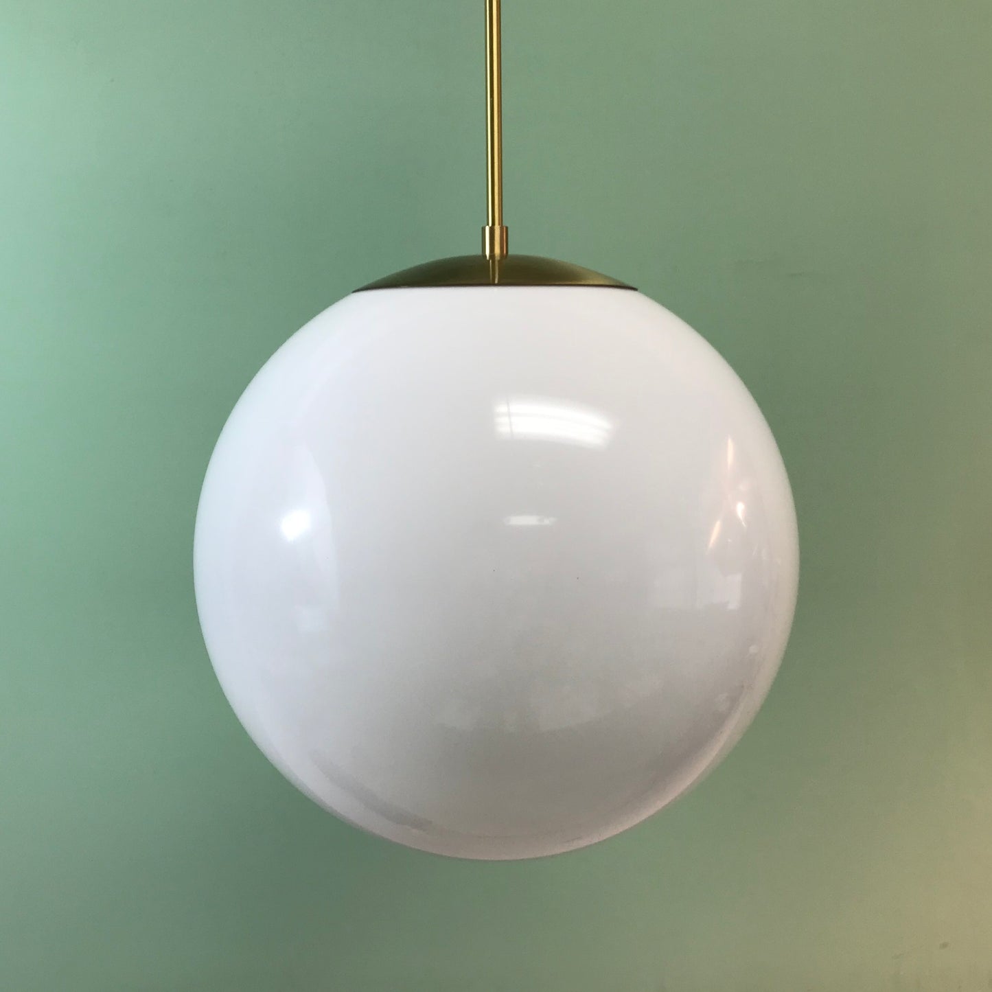 14" White Acrylic Globe Pendant Light by Practical Props