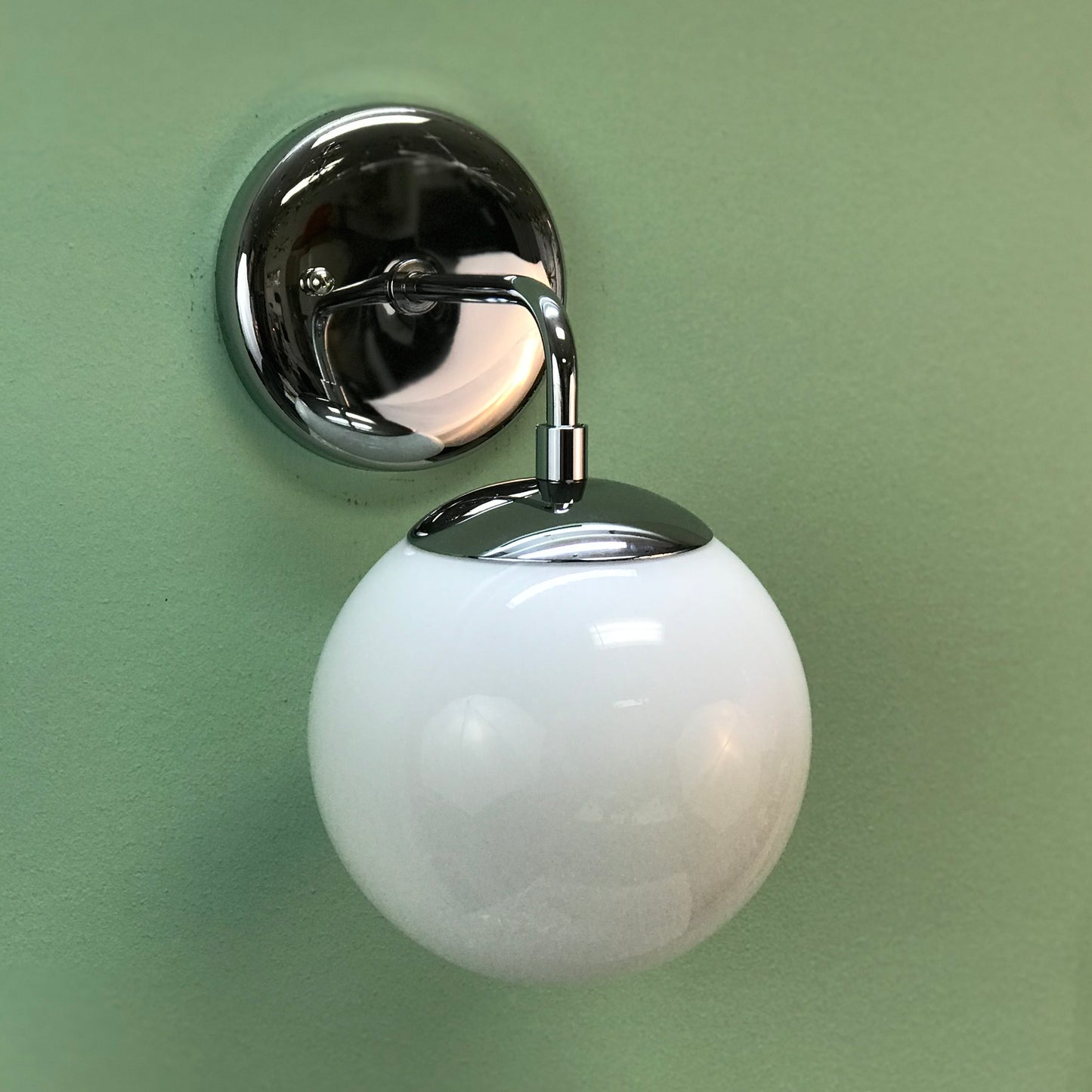 Modern Globe Wall Sconce Light in Polished Chrome by Practical Props